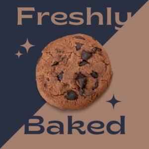 A freshly baked cookie of brown color with chocolate chips on blue and pink background